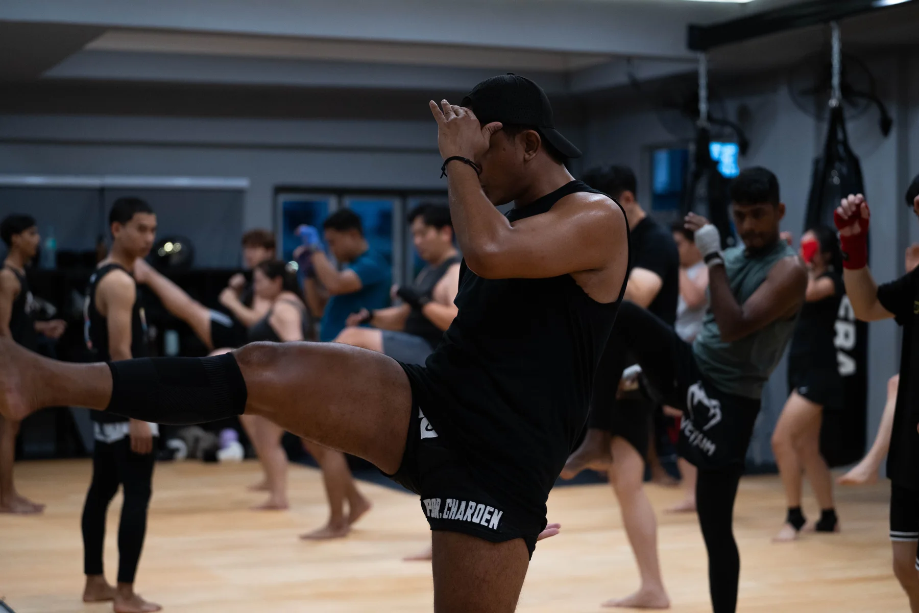 An athlete practising a kick in a FEBA Muay Thai class